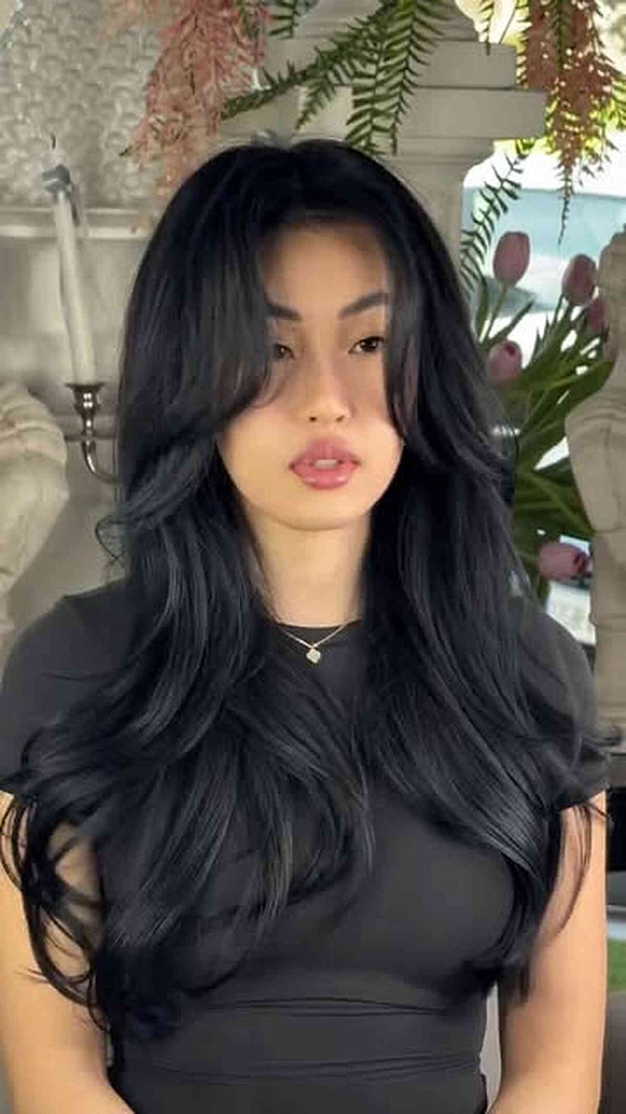 Mid-Back Layers With Curtain Bangs and Styled In A Voluminous Blowout — Black Wig Ideas