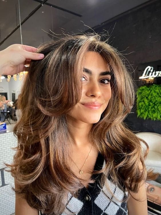 Mid-Back Brown Balayage Blowout With Curtain Bangs Mid-Back Brown Balayage Blowout With Curtain Bangs — Classy 90s Blowout Hair