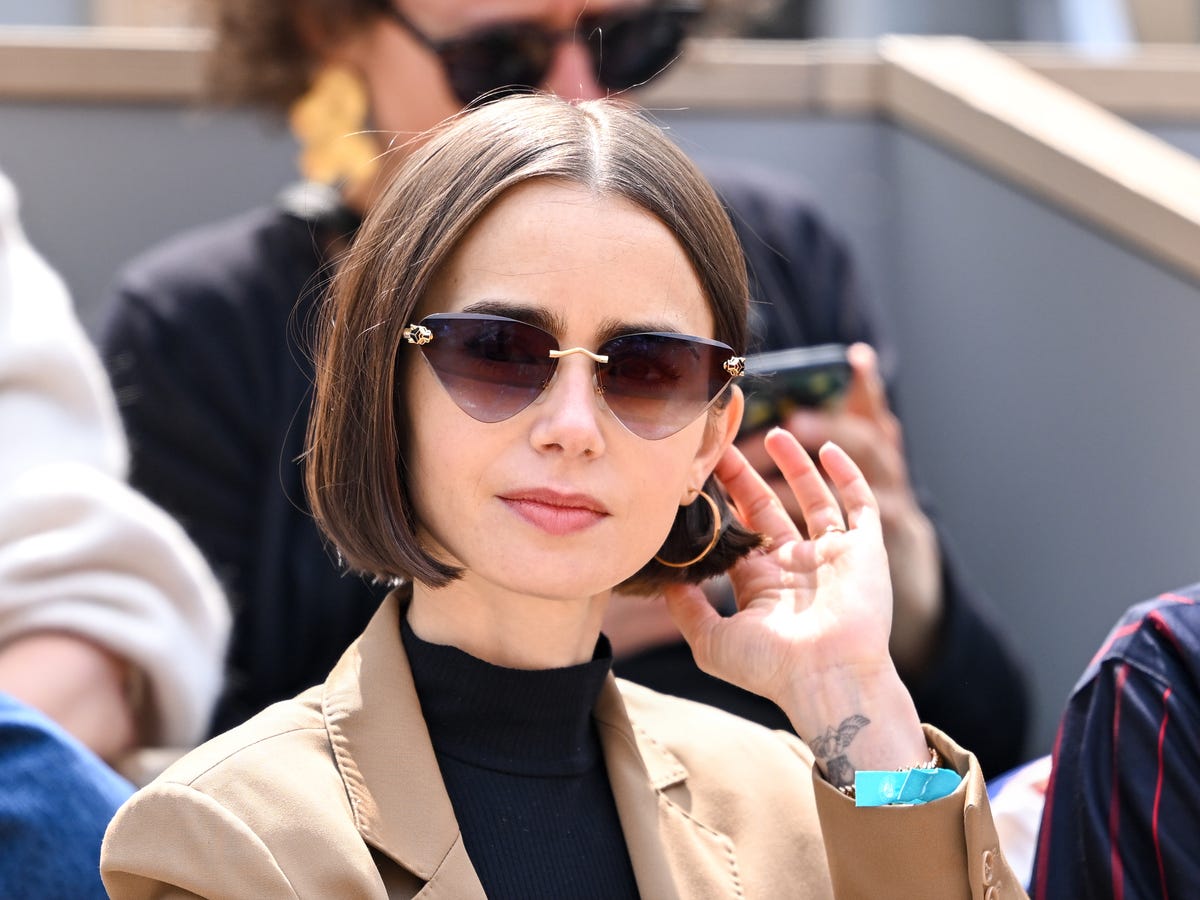 Sleek Dark Brown Chin Length Bob, Close-Up Take Sleek Dark Brown Chin Length Bob, Close-Up Take — Classy A-Line Bob