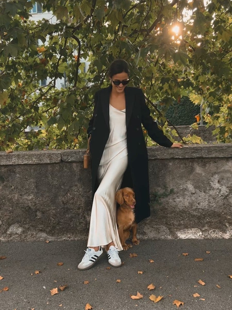 Cream Satin Slip Dress with Black Coat and White Adidas Samba Sneakers — Classy Adidas Samba Outfits