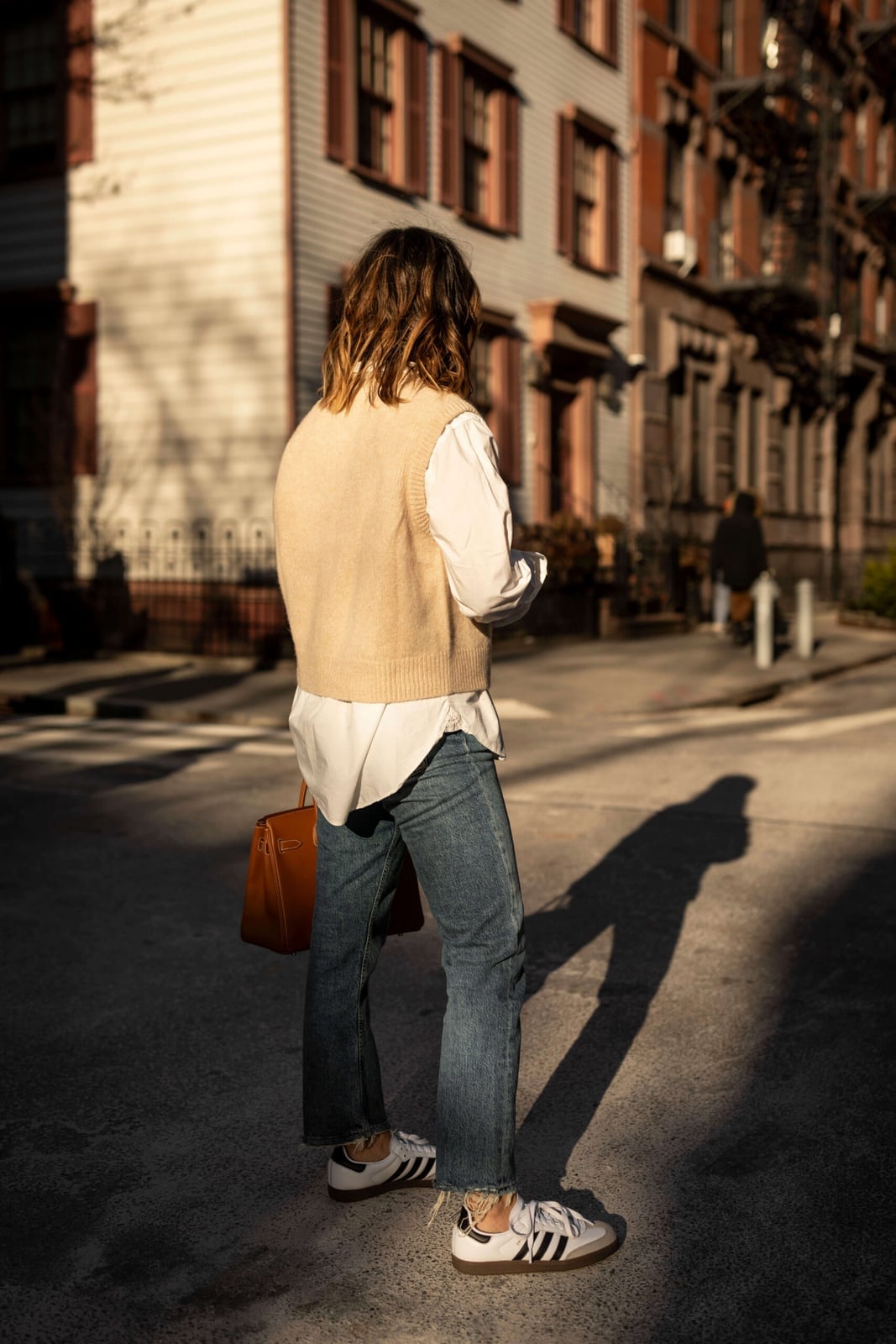 Beige Knit Vest Over White Shirt with Blue Jeans and White Adidas — Classy Adidas Samba Outfits