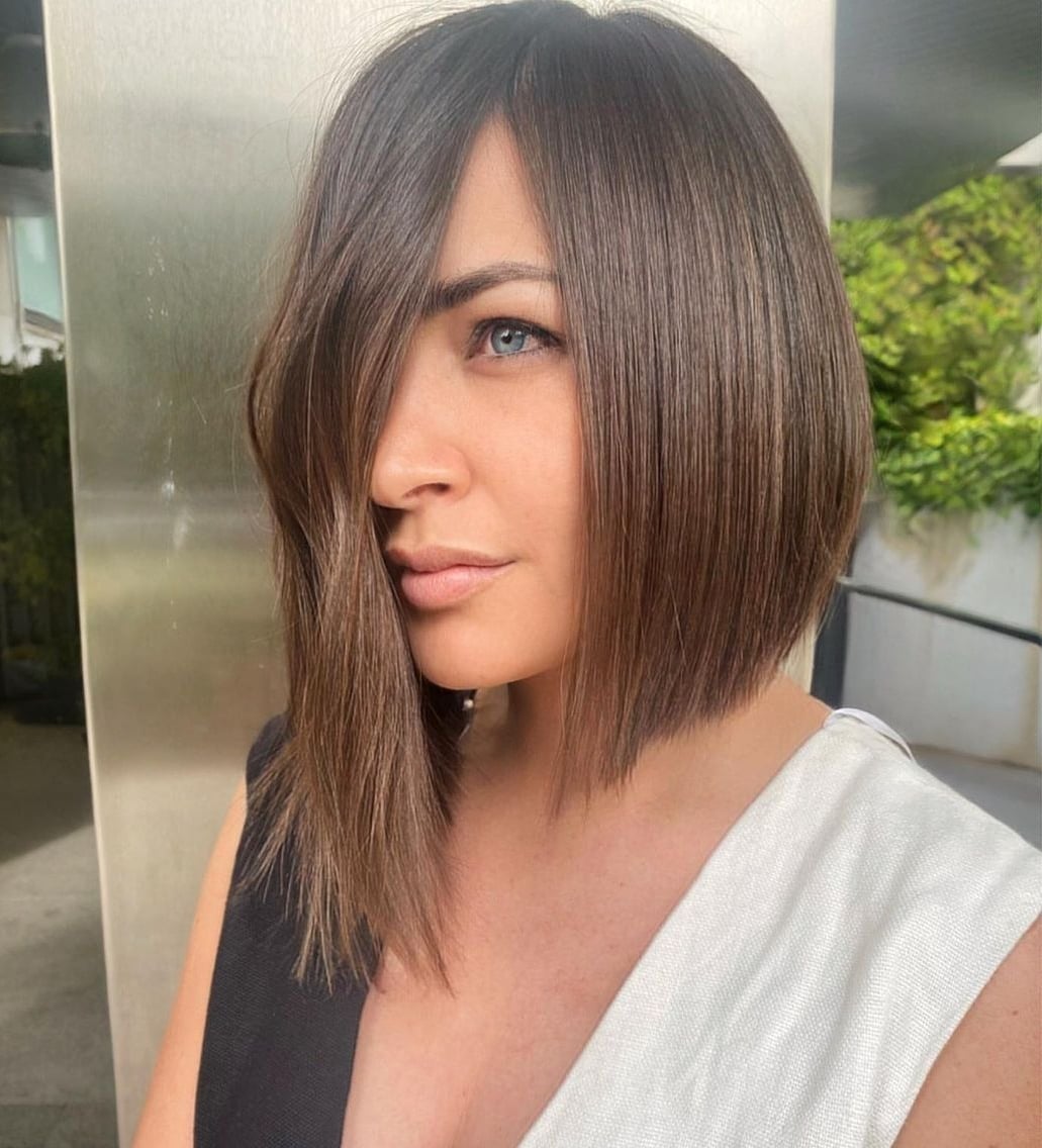 Dark Brown Bob With Long Side-Swept Fringe Dark Brown Bob With Long Side-Swept Fringe — Classy Asymmetrical Bob