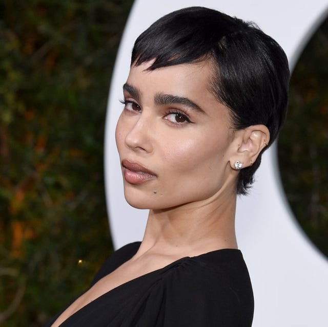 Minimalist Black Pixie With Swept-Forward Fringe Minimalist Black Pixie With Swept-Forward Fringe — Classy Asymmetrical Pixie