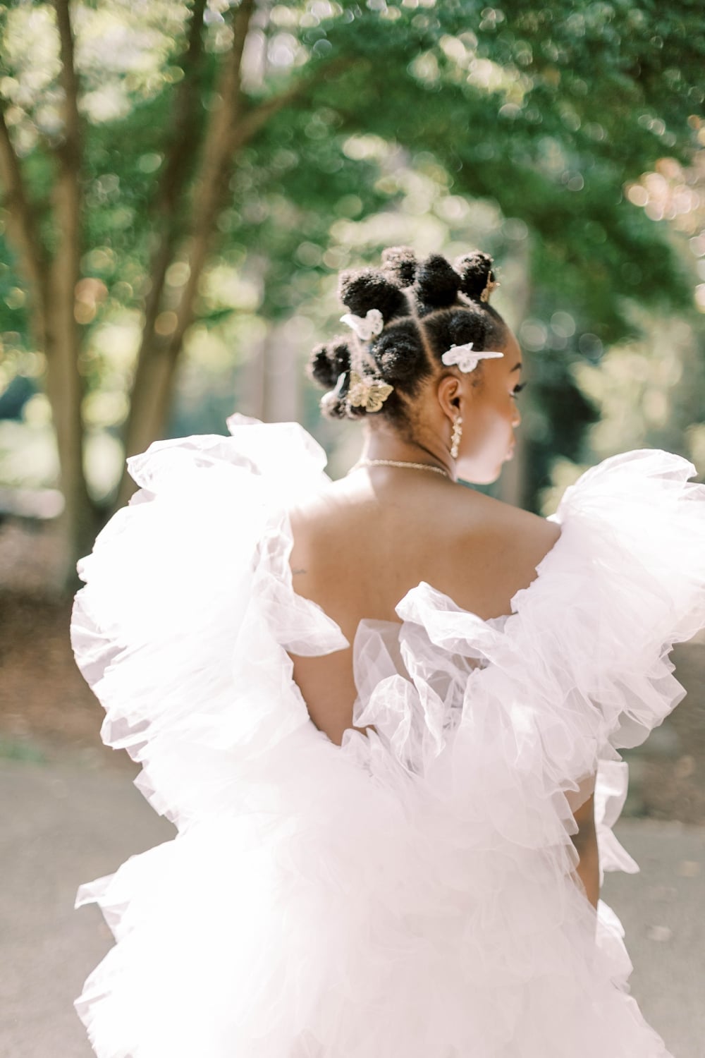 Bantu Knots with Floral Pins and a Bridal Gown and Gold Necklace Bantu Knots with Floral Pins and a Bridal Gown and Gold Necklace — Classy Bantu Knots