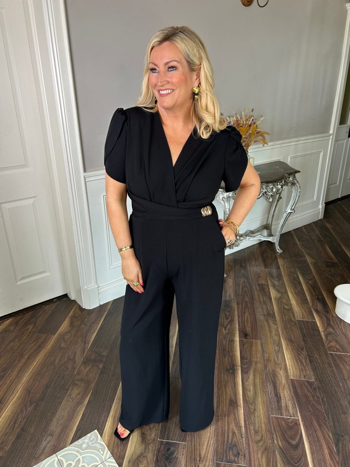 Puffed Sleeve Jumpsuit with Gold Buckle Detail Puffed Sleeve Jumpsuit with Gold Buckle Detail — Classy Black Jumpsuit Outfit