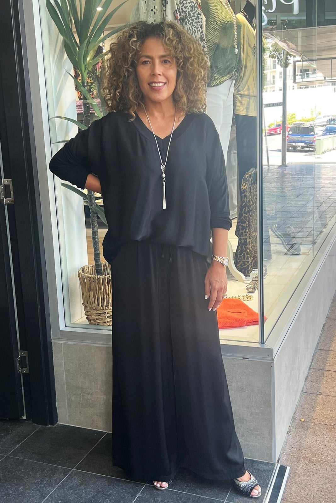 Black Wide-Leg Trousers with a Black Long-Sleeve Top — Classy Black Pants Outfits