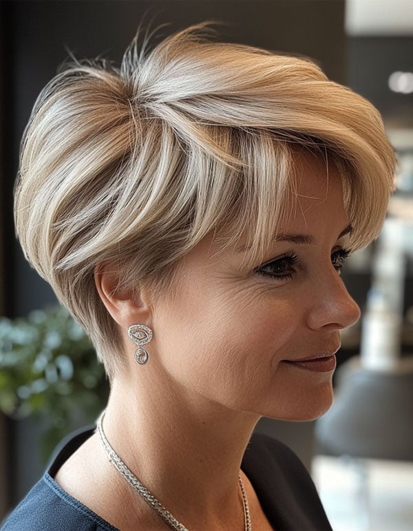 Platinum Pixie With Crown Volume And Swept Bangs Platinum Pixie With Crown Volume And Swept Bangs — Classy Blonde Haircuts