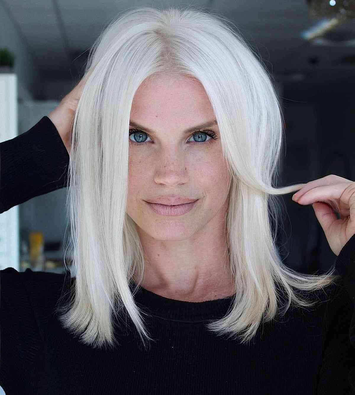 Icy White Blonde Long Bob With Curtain Bangs Icy White Blonde Long Bob With Curtain Bangs — Classy Blonde Haircuts
