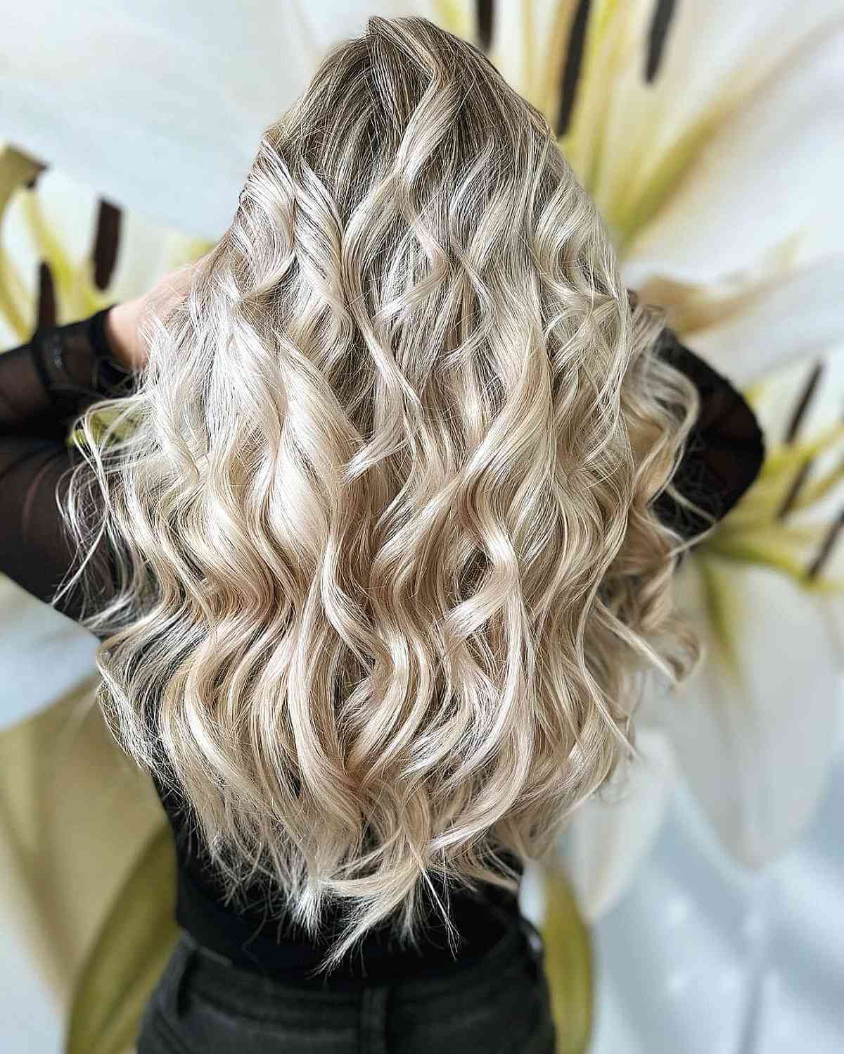 Ash Blonde Mid-Back Waves With Platinum Highlights Ash Blonde Mid-Back Waves With Platinum Highlights — Classy Blonde Haircuts