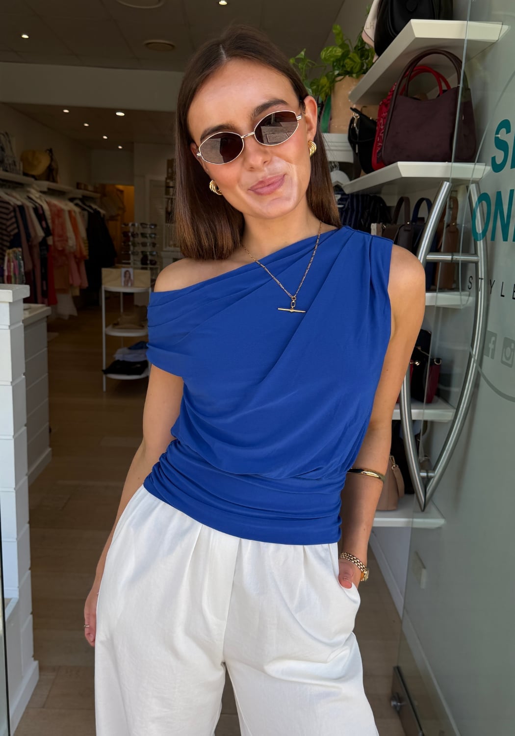 Cobalt Blue Asymmetric Draped Top with White Trousers Cobalt Blue Asymmetric Draped Top with White Trousers — Classy Blue Top Outfits