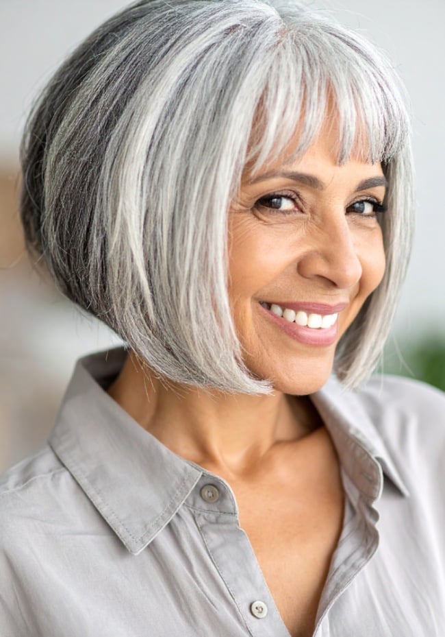Chin Length Gray Bob With Side-Swept Wispy Bangs Chin Length Gray Bob With Side-Swept Wispy Bangs — Classy Bob Haircuts with Bangs