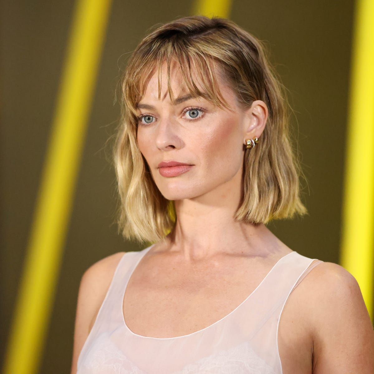 Ash Blonde Bob With Textured Wispy Bangs Ash Blonde Bob With Textured Wispy Bangs — Classy Bob Haircuts with Bangs
