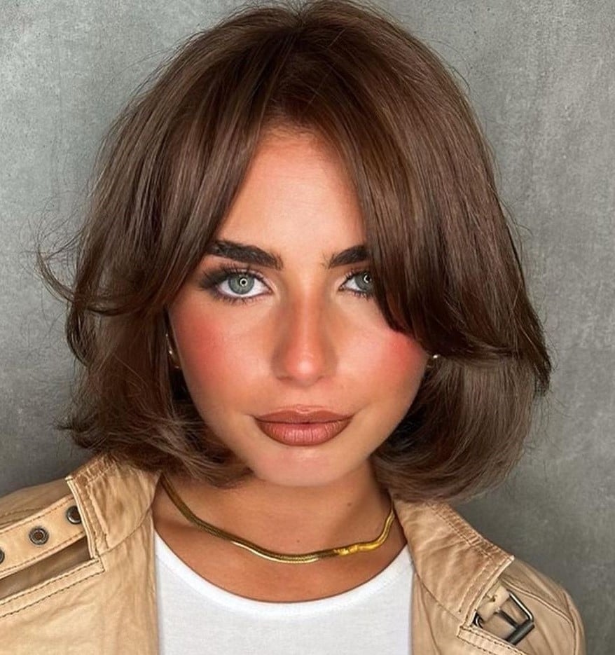 Medium Brown Bob With Smooth Blowout And Middle Part Curtain Bangs Medium Brown Bob With Smooth Blowout And Middle Part Curtain Bangs — Classy Bob with Curtain Bangs