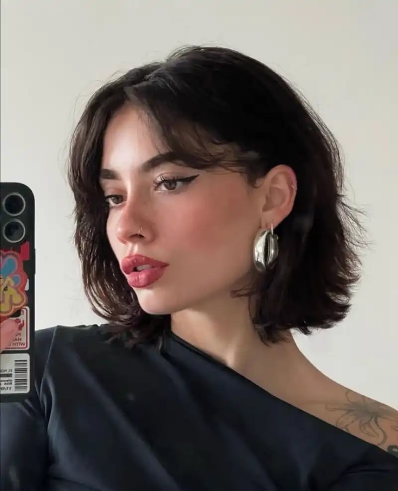 Dark Brown Bob With Natural Wavy Texture And Curtain Bangs Dark Brown Bob With Natural Wavy Texture And Curtain Bangs — Classy Bob with Curtain Bangs