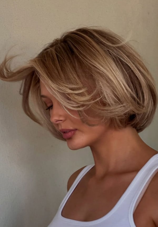 Collarbone Bob With Voluminous Warm Blonde And Curtain Bangs Collarbone Bob With Voluminous Warm Blonde And Curtain Bangs — Classy Bob with Curtain Bangs