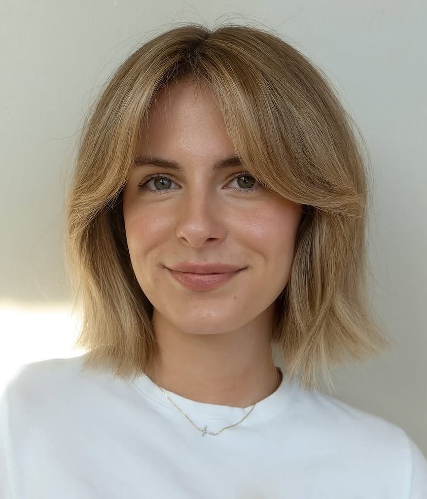 Collarbone Bob With Ash Blonde Layers And Middle Part Curtain Bangs Collarbone Bob With Ash Blonde Layers And Middle Part Curtain Bangs — Classy Bob with Curtain Bangs