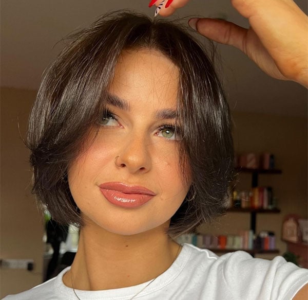 Chin Length Bob With Smooth Blowout And Dark Brown Curtain Bangs Chin Length Bob With Smooth Blowout And Dark Brown Curtain Bangs — Classy Bob with Curtain Bangs