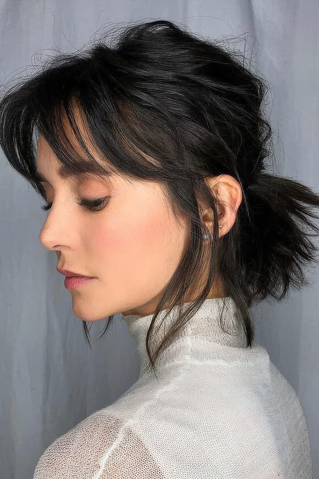 Shoulder Length Dark Brown Messy Ponytail With Wispy Bangs Shoulder Length Dark Brown Messy Ponytail With Wispy Bangs — Classy Bottleneck Bangs