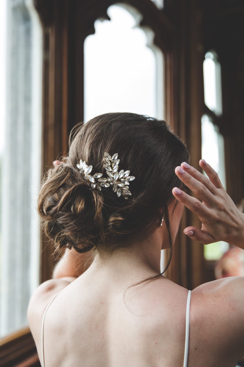 Dark Brown Wavy Updo With Sparkling Accessory Dark Brown Wavy Updo With Sparkling Accessory — Classy Bridal Bun