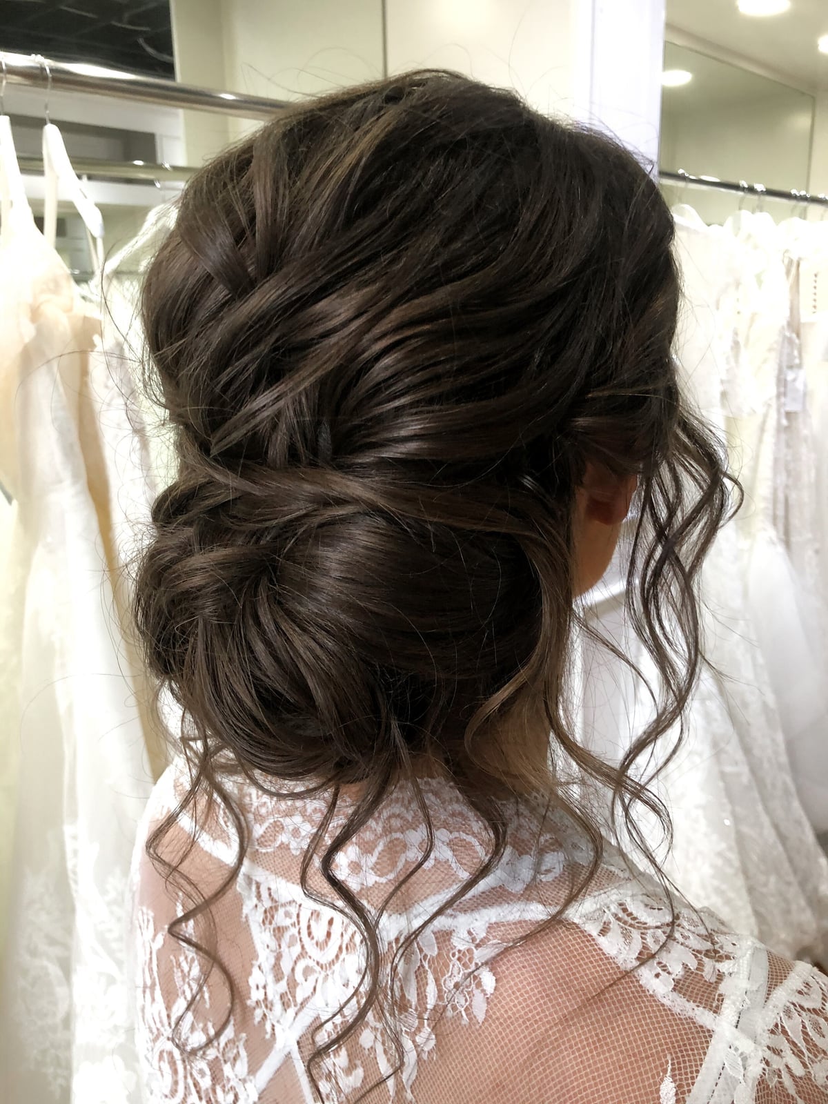 Voluminous Dark Brown Textured Bun Voluminous Dark Brown Textured Bun — Classy Bridal Bun