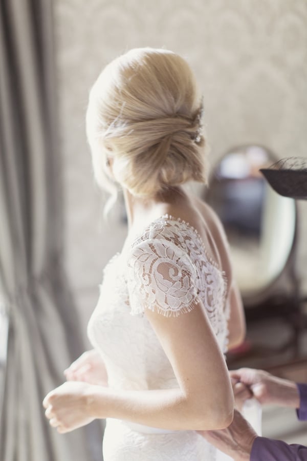 Light Blonde Soft Tucked Bun With Wispy Pieces Light Blonde Soft Tucked Bun With Wispy Pieces — Classy Bridal Bun