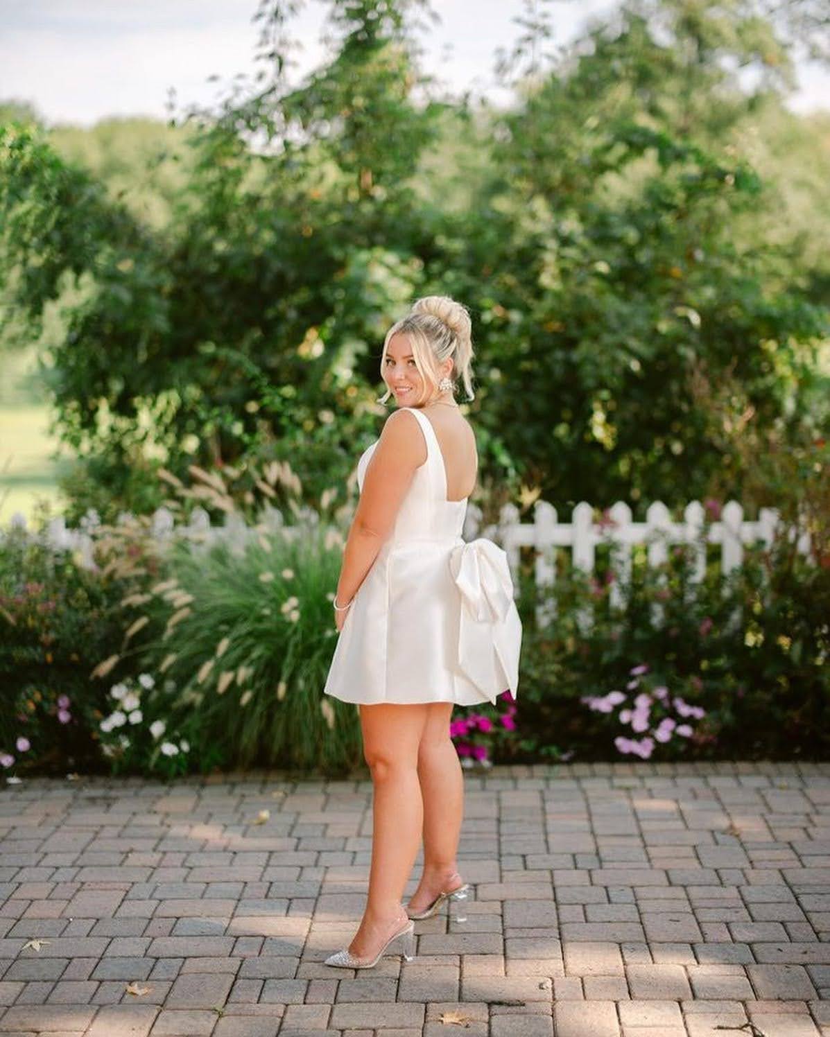 White Satin Mini Dress with Bow Detail White Satin Mini Dress with Bow Detail — Classy Bridal Shower Outfits for Guest