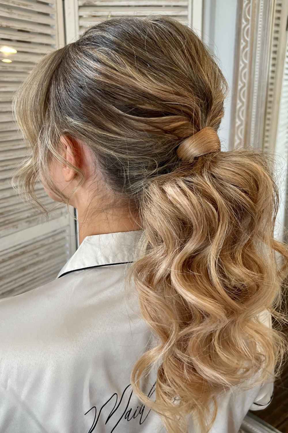 Ash Blonde Ponytail With Voluminous Waves And Side Swept Bangs Ash Blonde Ponytail With Voluminous Waves And Side Swept Bangs — Classy Bridesmaid Ponytail