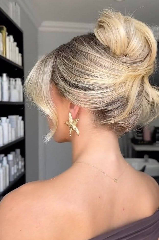 Platinum Blonde High Voluminous Bun With Tendrils Platinum Blonde High Voluminous Bun With Tendrils — Classy Bridesmaid Updos