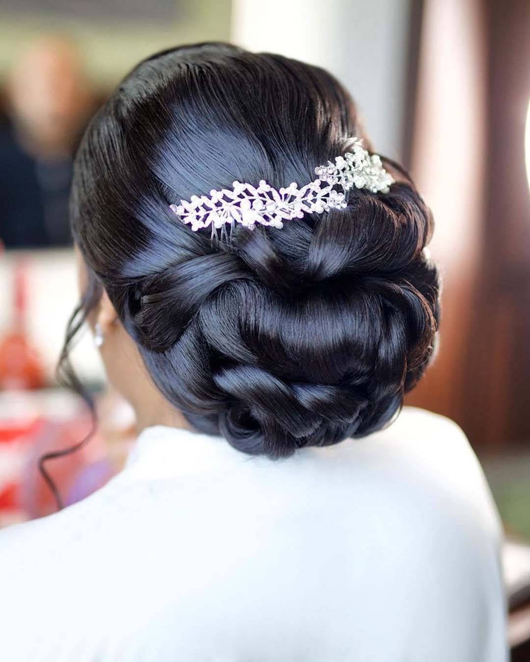 Sleek Black Intricate Chignon With Accessory Sleek Black Intricate Chignon With Accessory — Classy Bridesmaid Updos