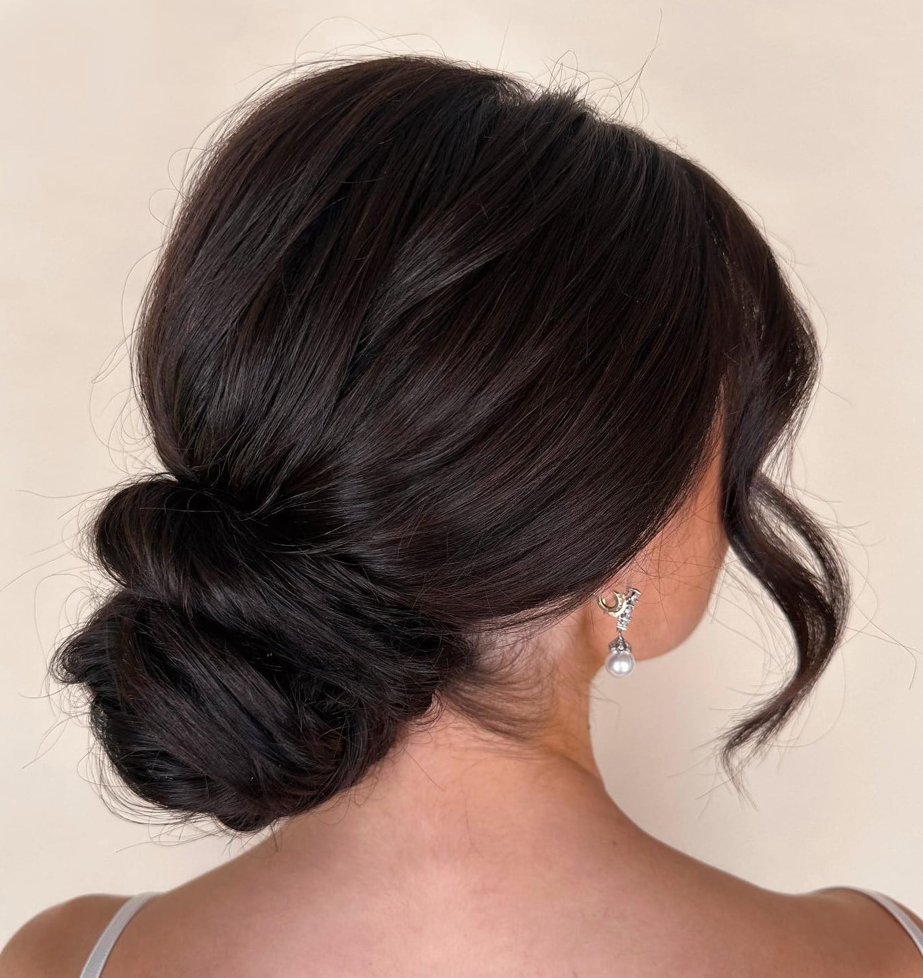 Voluminous Low Bun Dark Brown Side-Swept Bangs — Classy Bun and Bang