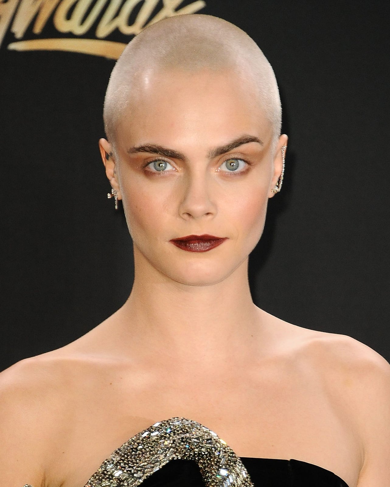 Shaved Head With Statement Silver Earrings Shaved Head With Statement Silver Earrings — Classy Buzz Cut