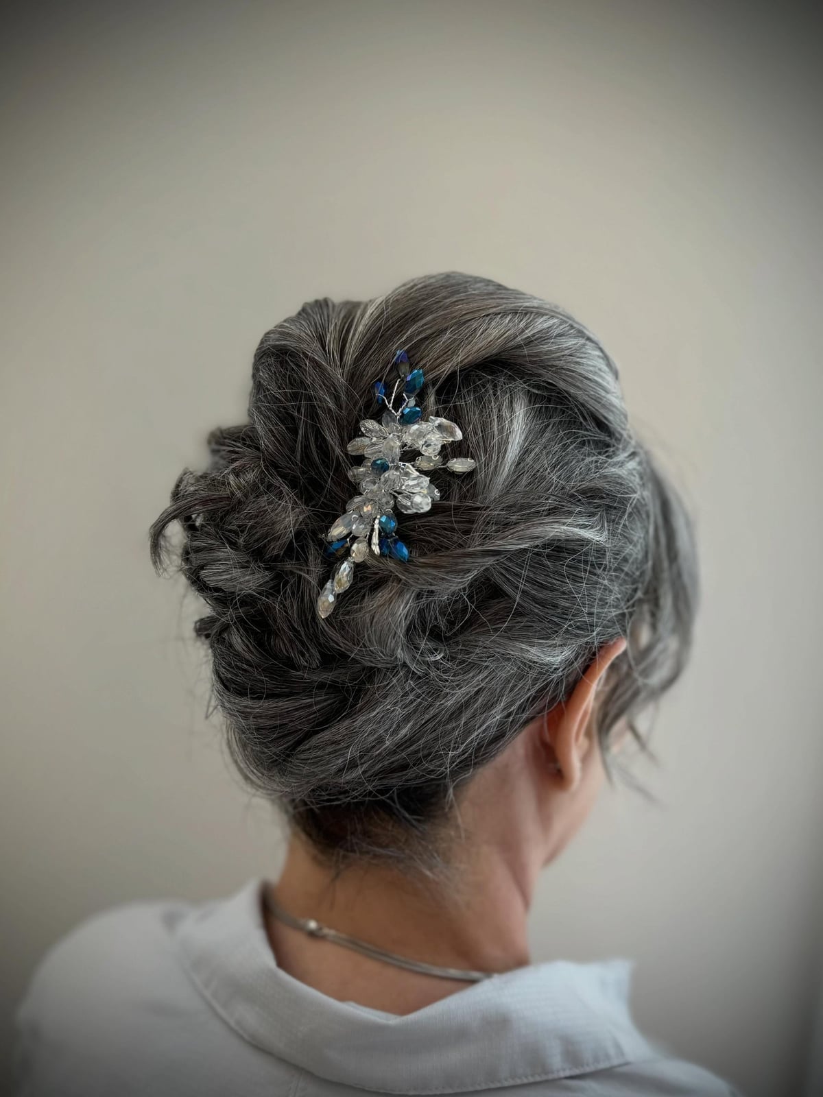 High Grey Bun With Ornate Hair Accessory High Grey Bun With Ornate Hair Accessory — Classy Casual Updo