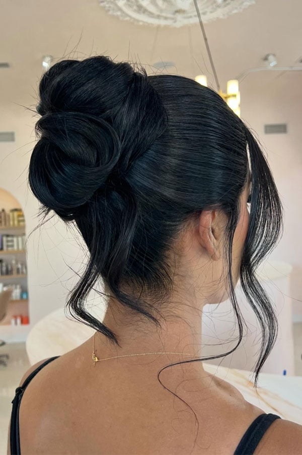 Sleek Black High Bun With Face-Framing Tendrils Sleek Black High Bun With Face-Framing Tendrils — Classy Casual Updo