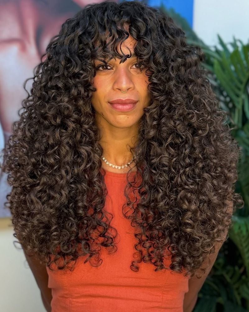 Mid-Back Voluminous Curls With Curtain Bangs Mid-Back Voluminous Curls With Curtain Bangs — Classy Curly Hair Layers