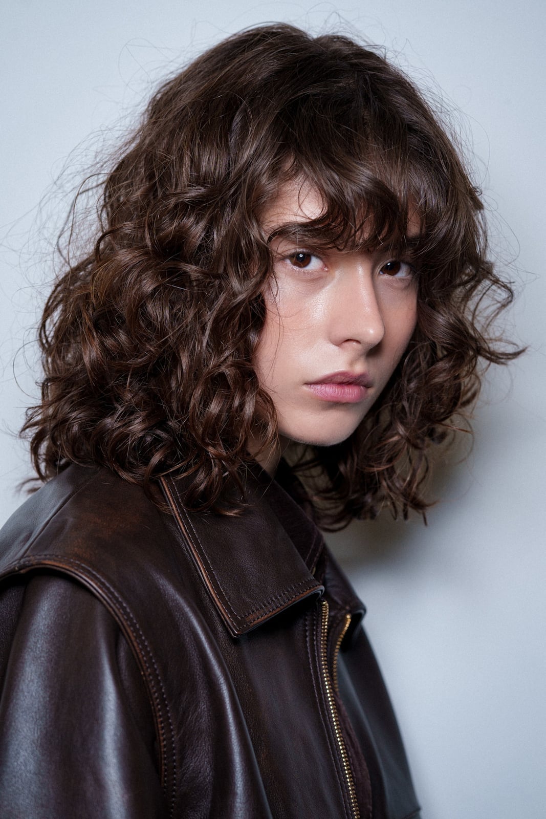 Collarbone Layered Shag With Curly Bangs Collarbone Layered Shag With Curly Bangs — Classy Curly Haircuts