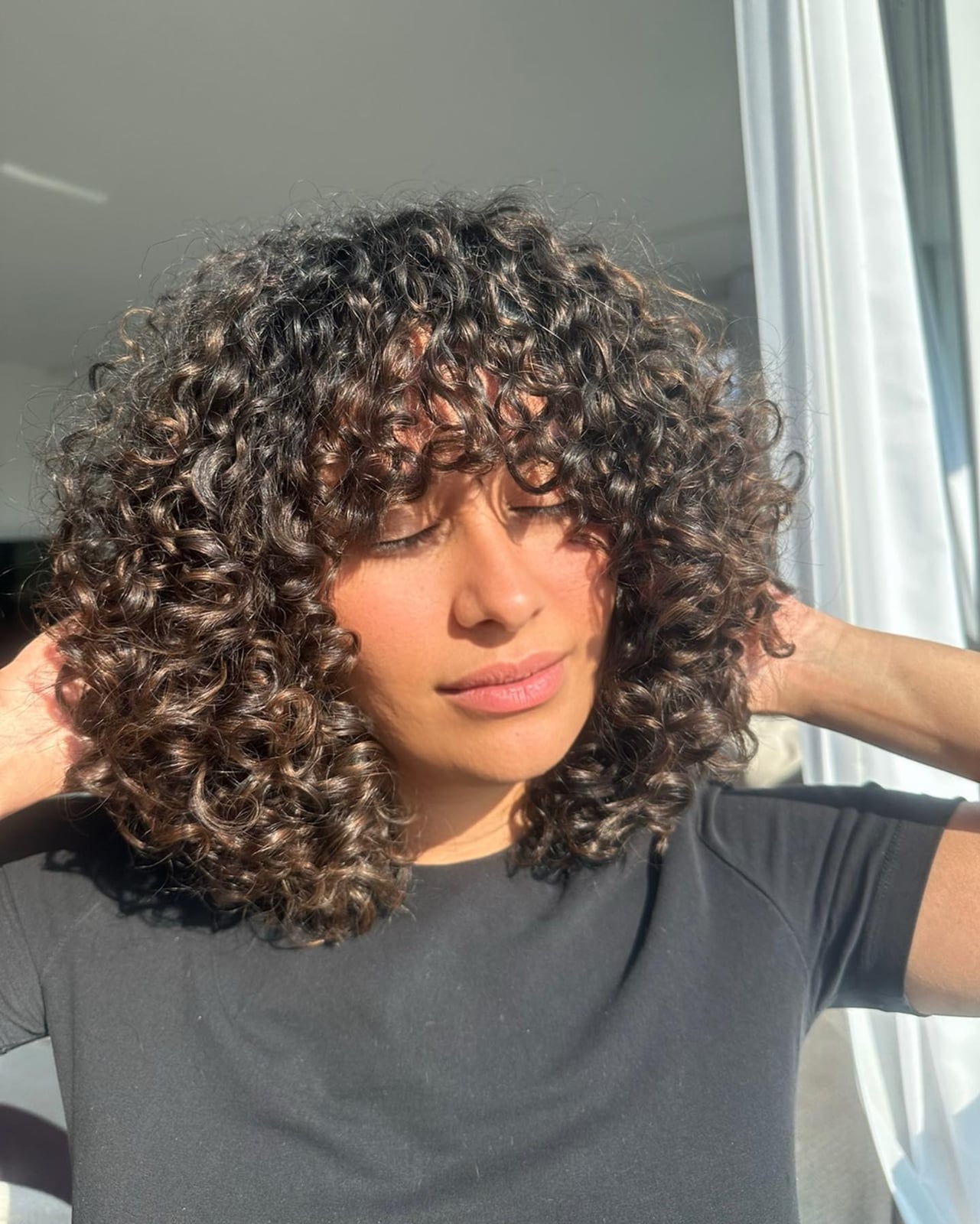 Sunlit Curls With Collarbone Layers Sunlit Curls With Collarbone Layers — Classy Curly Highlights