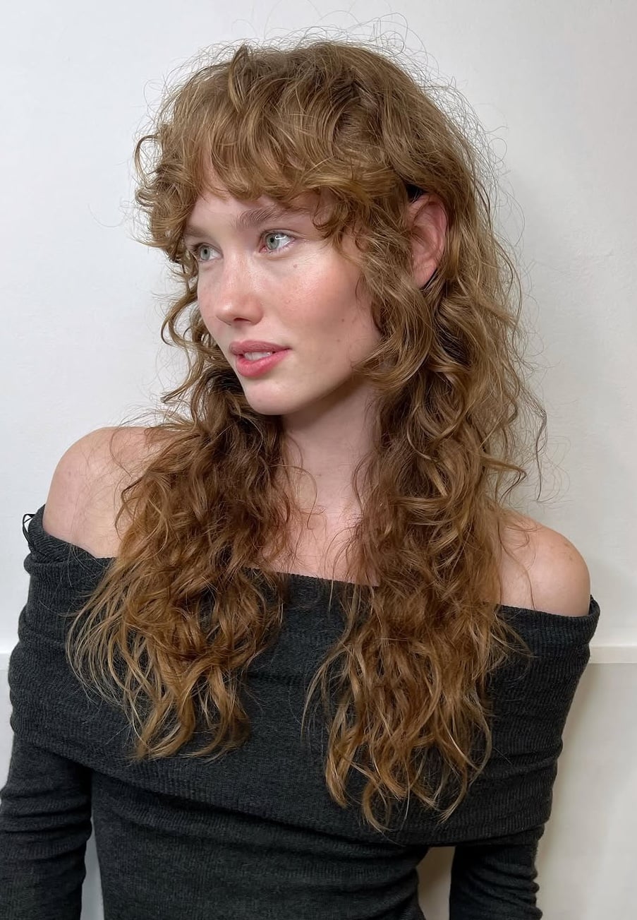 Medium Brown Shag With Face-Framing Curtain Bangs Medium Brown Shag With Face-Framing Curtain Bangs — Classy Curly Shag Haircut