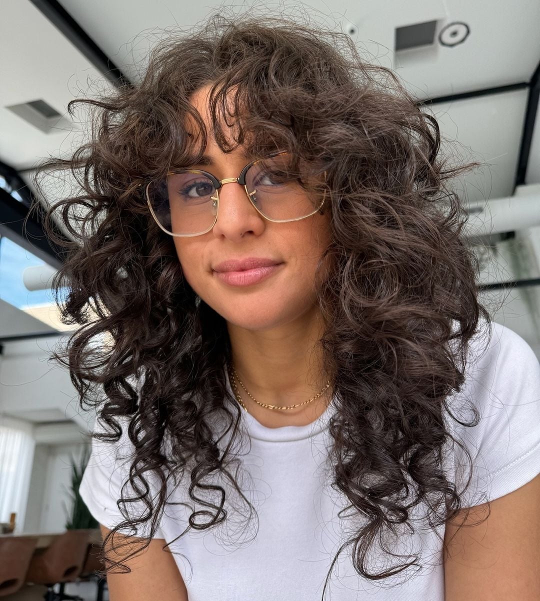 Mid-Back Dark Brown Wolf Cut With Curtain Bangs Mid-Back Dark Brown Wolf Cut With Curtain Bangs — Classy Curly Wolf Cut