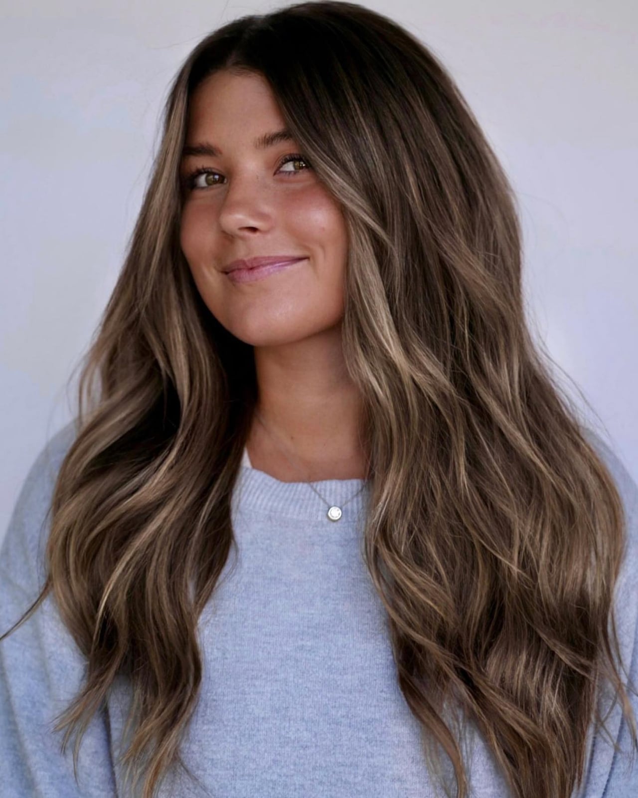 Mid-Back Waves With Blonde Balayage — Classy Dark Brown Hair with Blonde