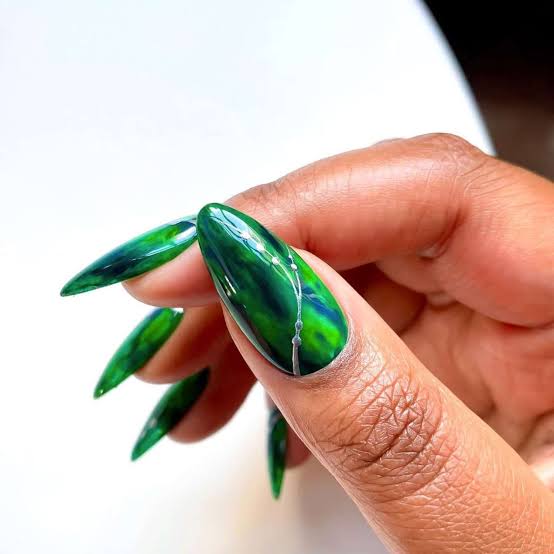 Long Stiletto Nails With Abstract Green And Gold Foil Long Stiletto Nails With Abstract Green And Gold Foil — Classy Emerald Green Nails