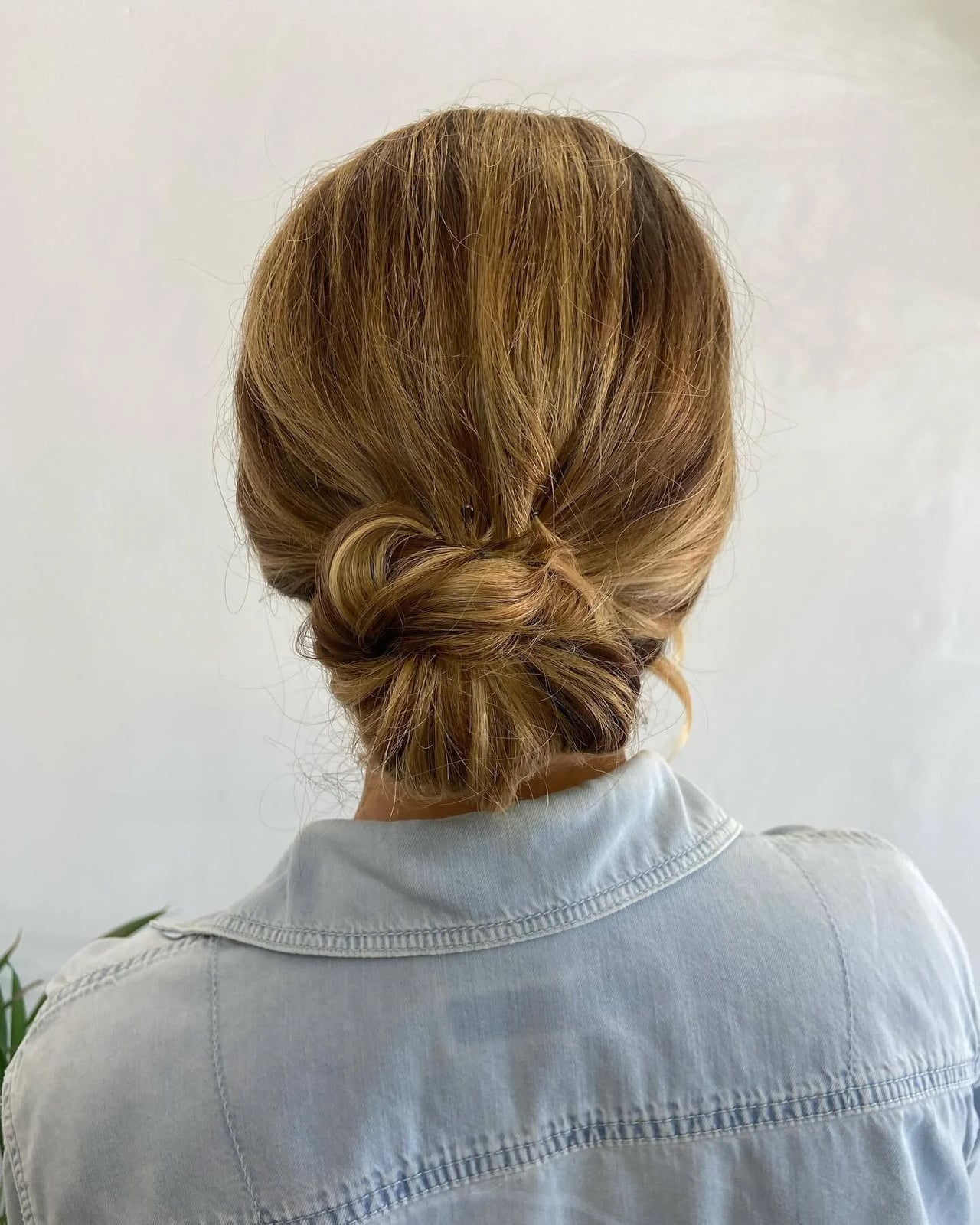Low Bun With Intricate Knot Detail — Classy Hair Types Chart