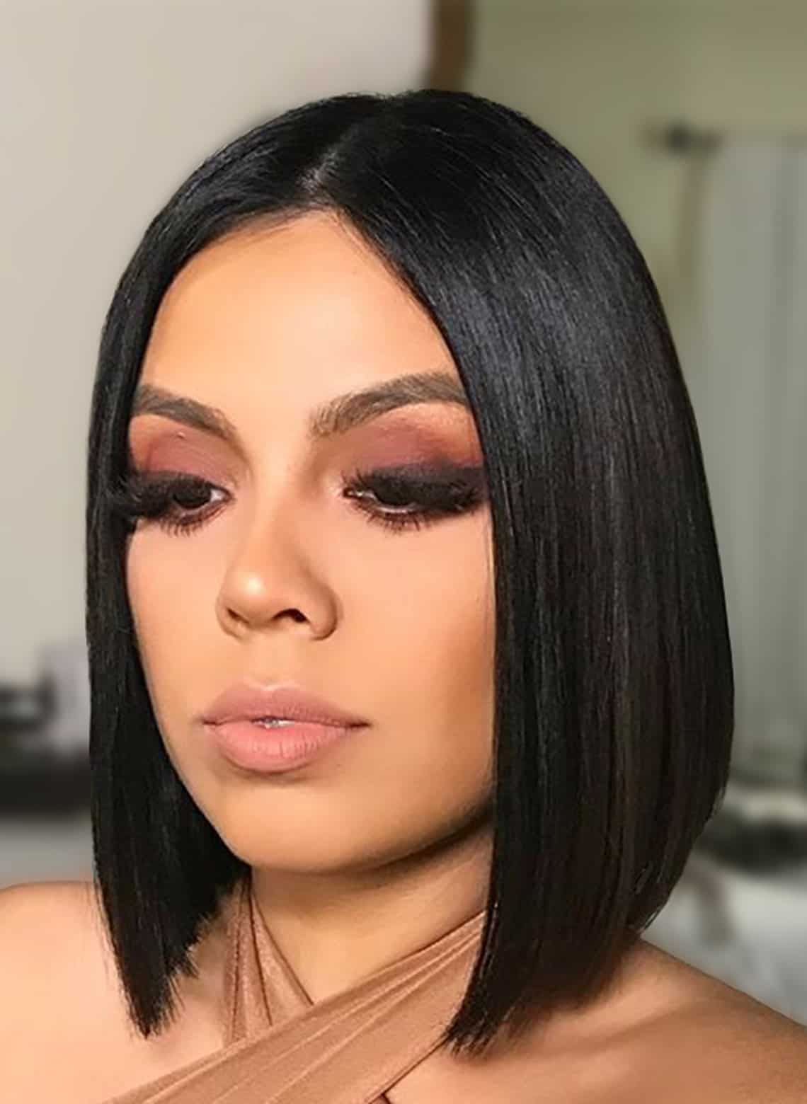Chin Length Black Bob With Sharp Line And Side Bangs — Classy Haircuts for Round Face