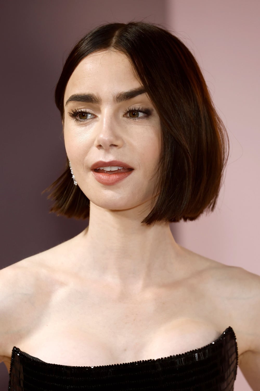 Sleek Chin Length Bob In Dark Brown With Precise Line Around The Jaw — Classy Haircuts for Round Face