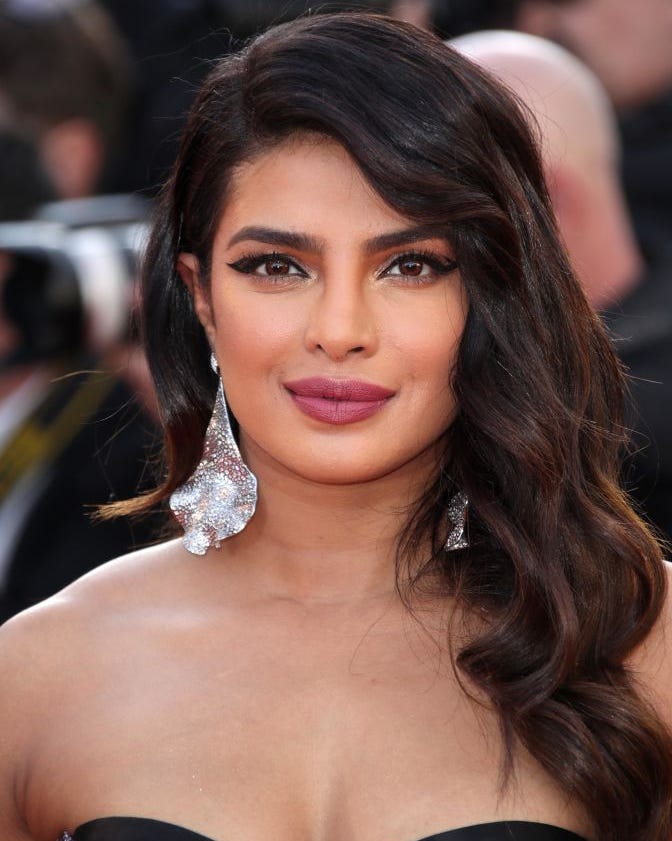 Shoulder Lob With Voluminous Waves And Side-Swept Bangs — Classy Haircuts for Round Face