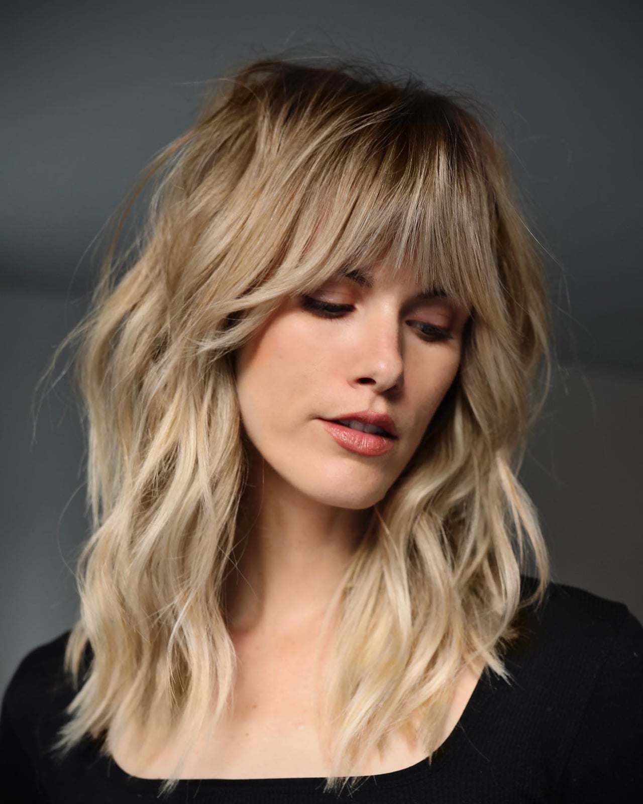 Collarbone Shag With Full Curtain Bangs Collarbone Shag With Full Curtain Bangs — Classy Haircuts for Wavy Hair