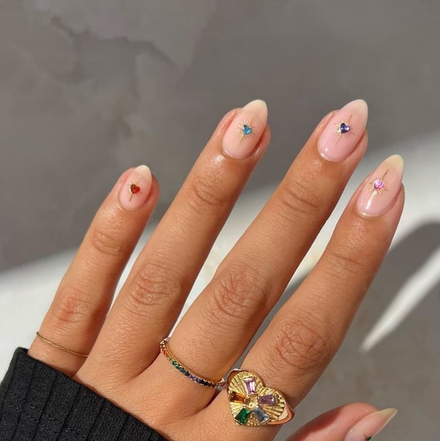 Short Oval Sheer Pink With Heart Accents, Close-Up Take Short Oval Sheer Pink With Heart Accents, Close-Up Take — Classy Hand Nails
