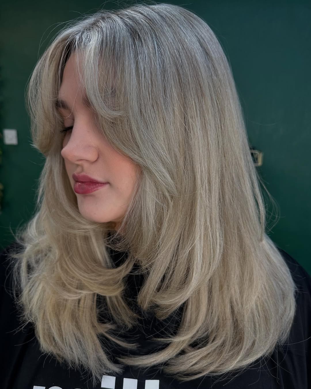 Black Knit Top With Layered Blonde Waves Black Knit Top With Layered Blonde Waves — Classy Hush Cut