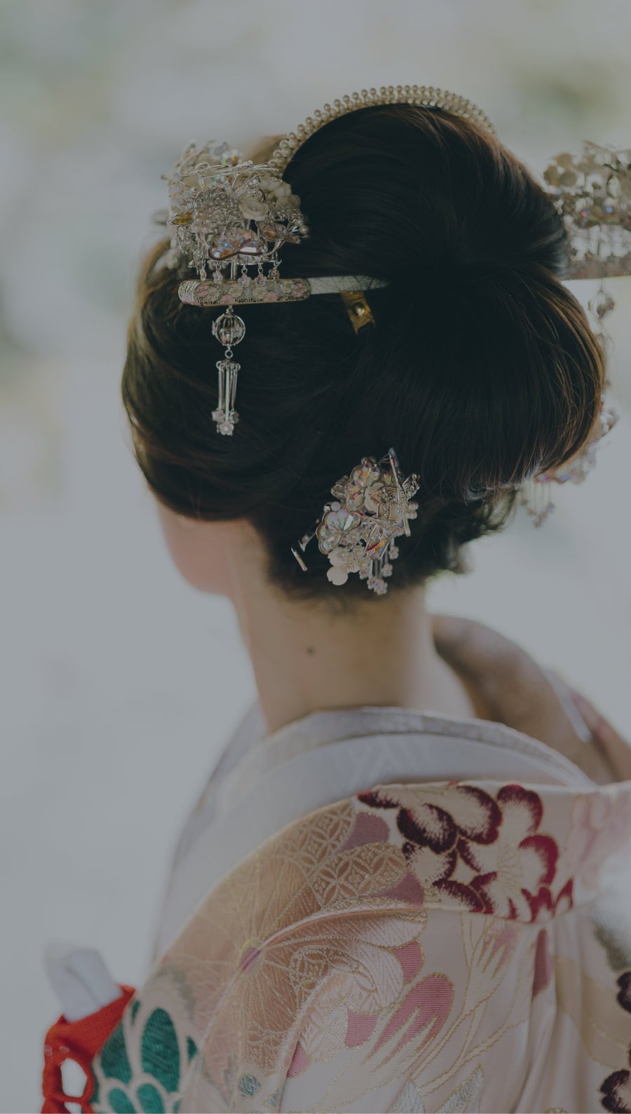 Glossy Black Updo With Floral Ornaments Glossy Black Updo With Floral Ornaments — Classy Japanese Hairstyles