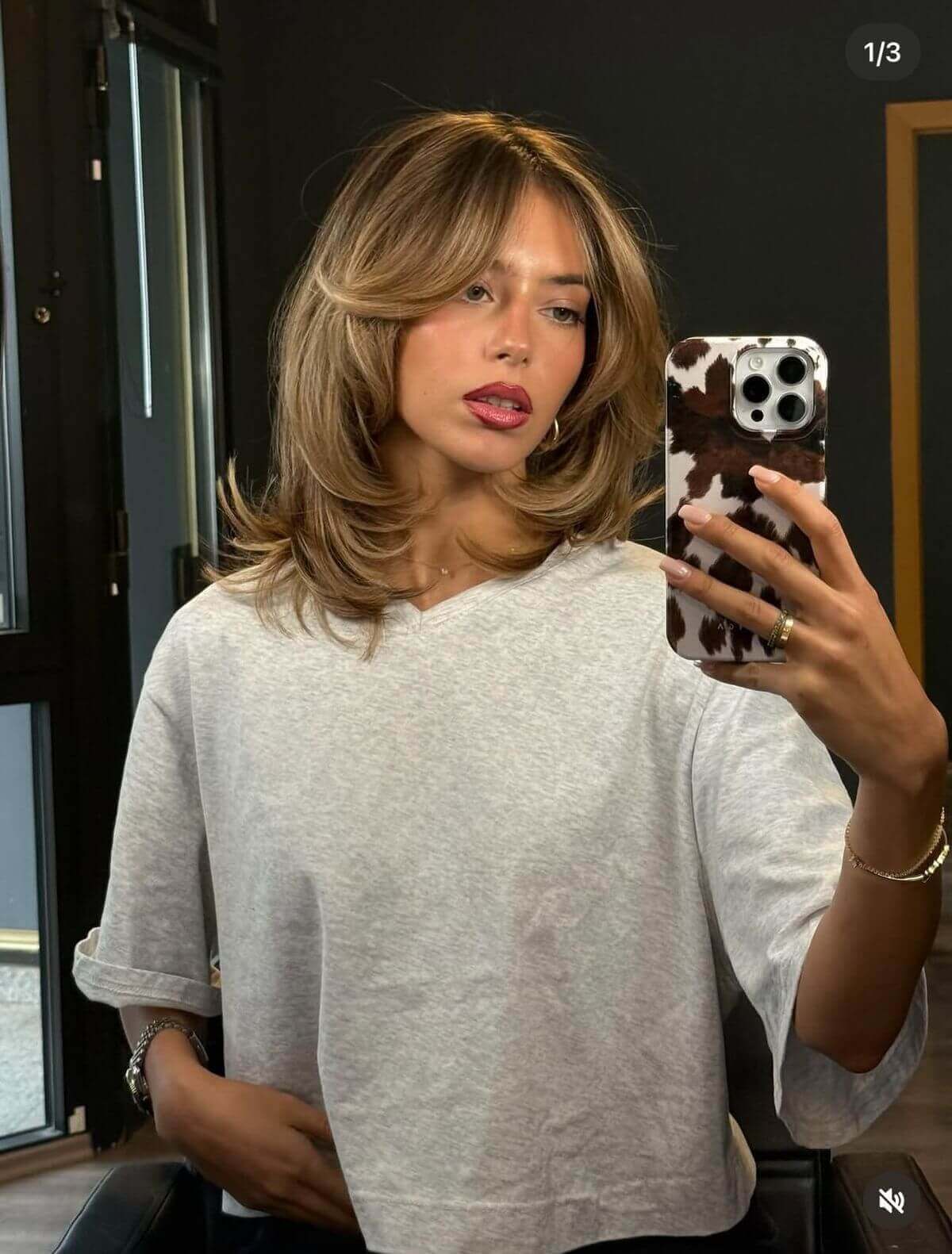 Collarbone Dark Blonde Layers With Highlights and Curtain Bangs — Classy Layered Haircuts for Medium Hair