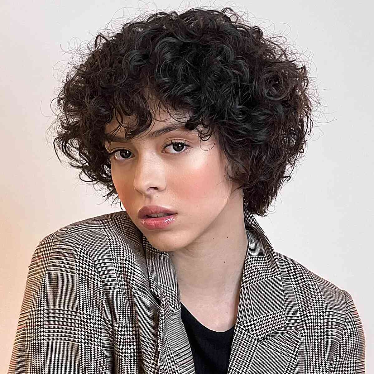 Thick Curly Black Chin-Length Cut Thick Curly Black Chin-Length Cut — Classy Lesbian Haircuts